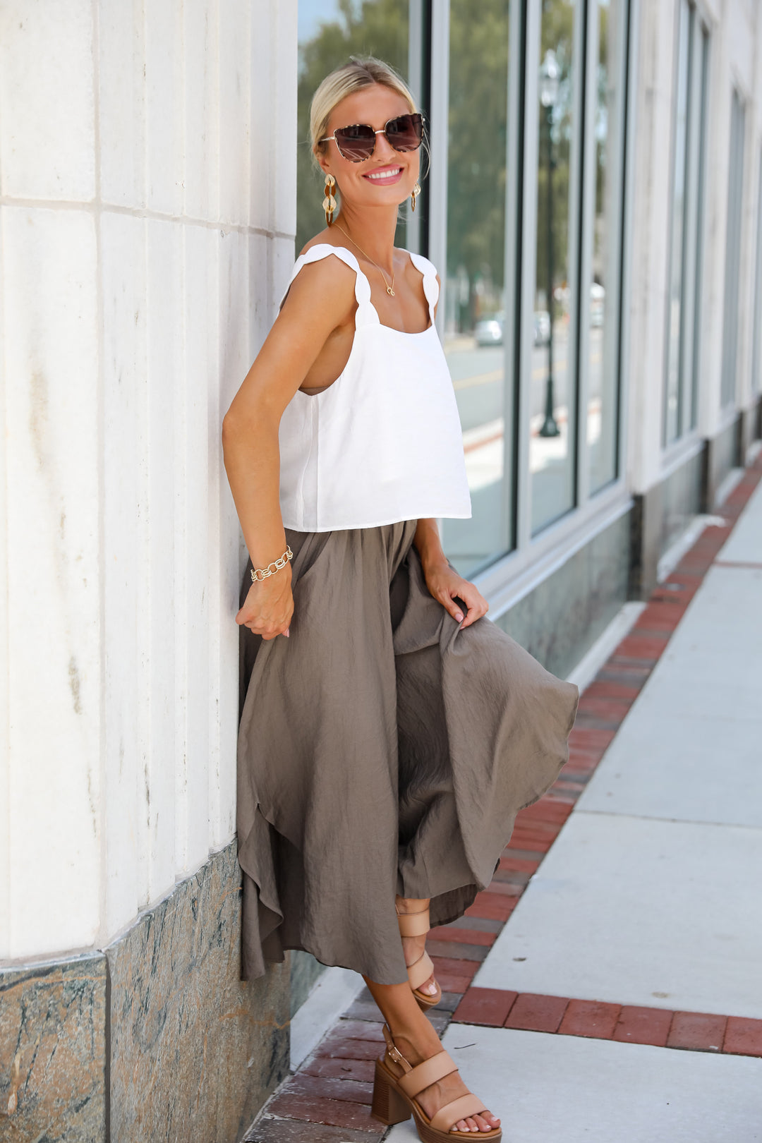 dress up model wearing trending denim skirt outfit idea with green sweater