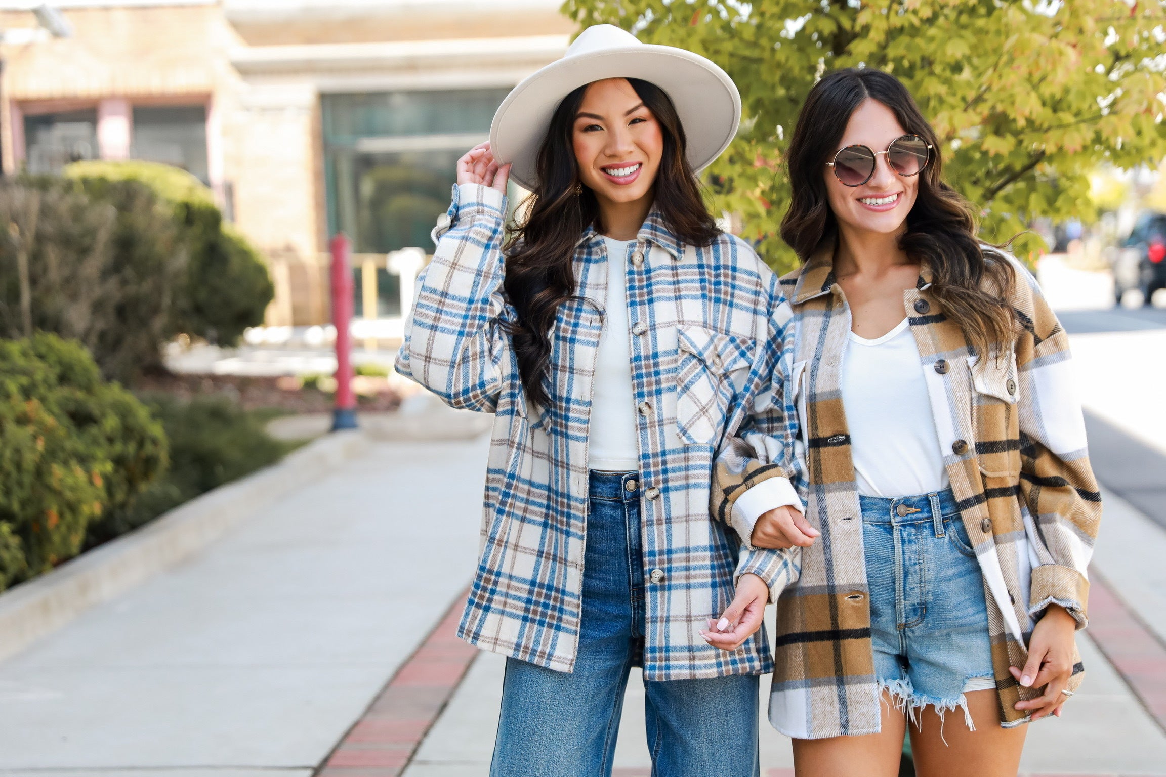 An array of fall flannels in warm earthy tones, featuring classic plaids and versatile layering options for autumn and winter fashion.