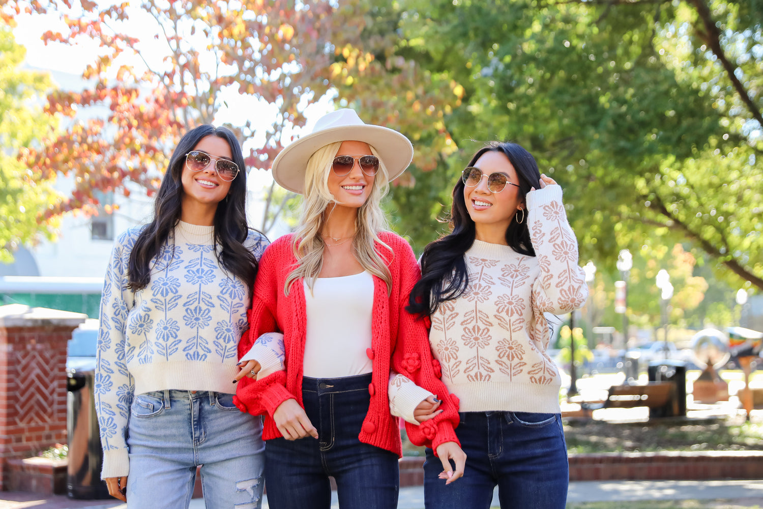 three models wearing cute fall sweaters