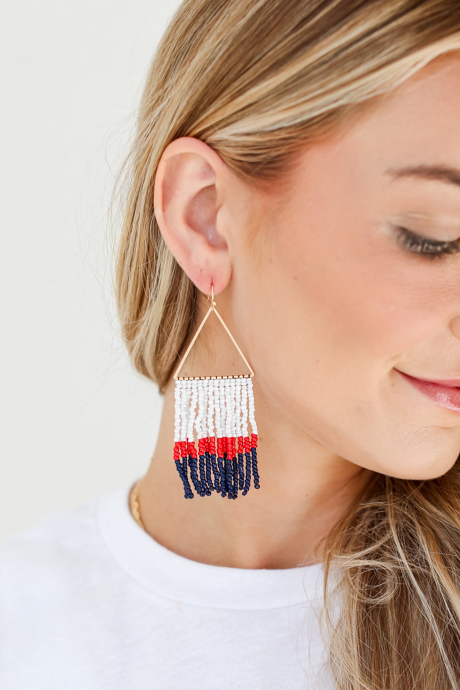 White + Navy Beaded Fringe Earrings on model