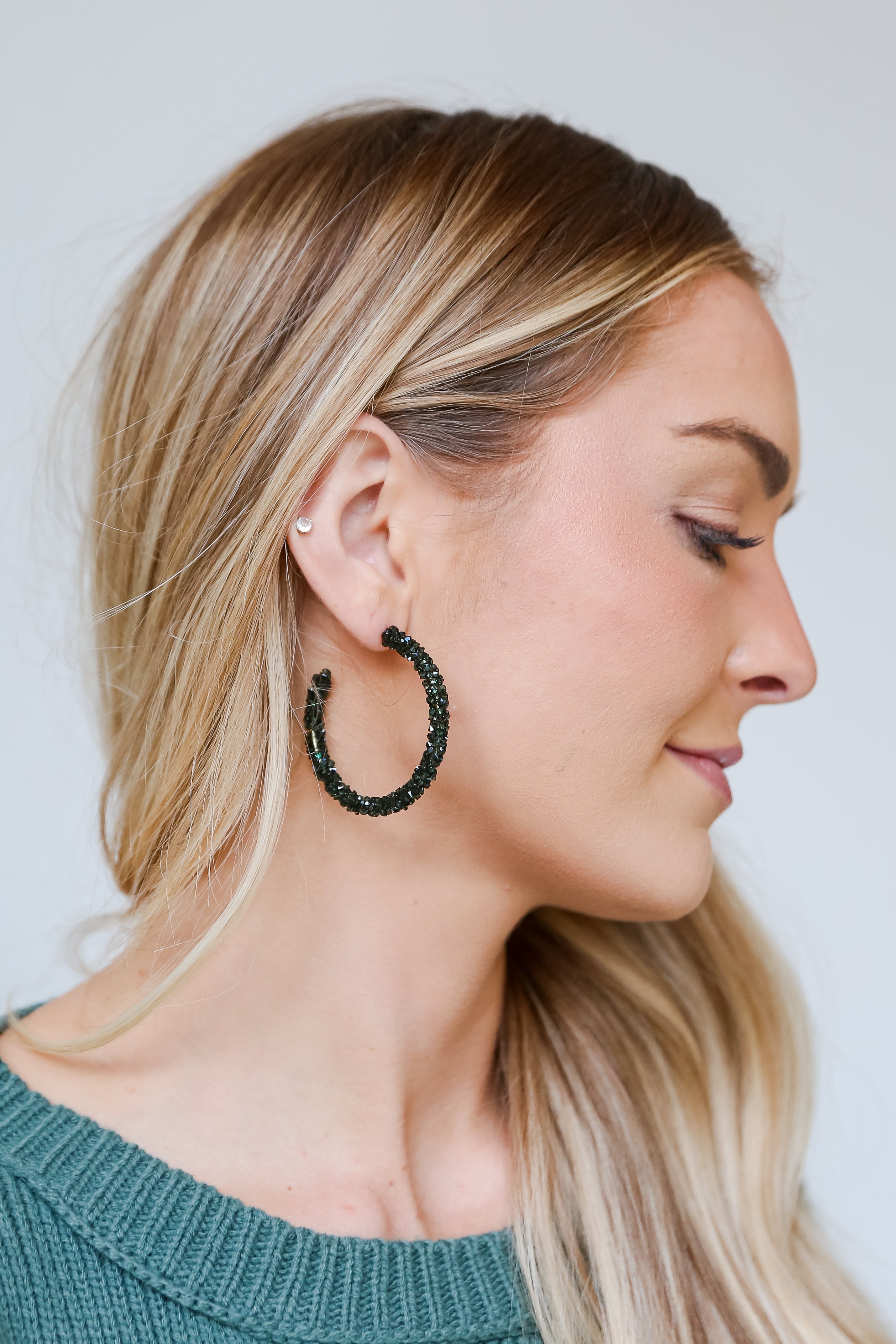 green Beaded Hoop Earrings on model