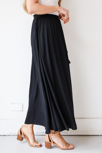 On My Mind Black Maxi Skirt has a flowy fit, elastic waistband, high-waisted skirt. Cute black skirt for summer. Pair with cute sandals, spring break outfit. online boutique 