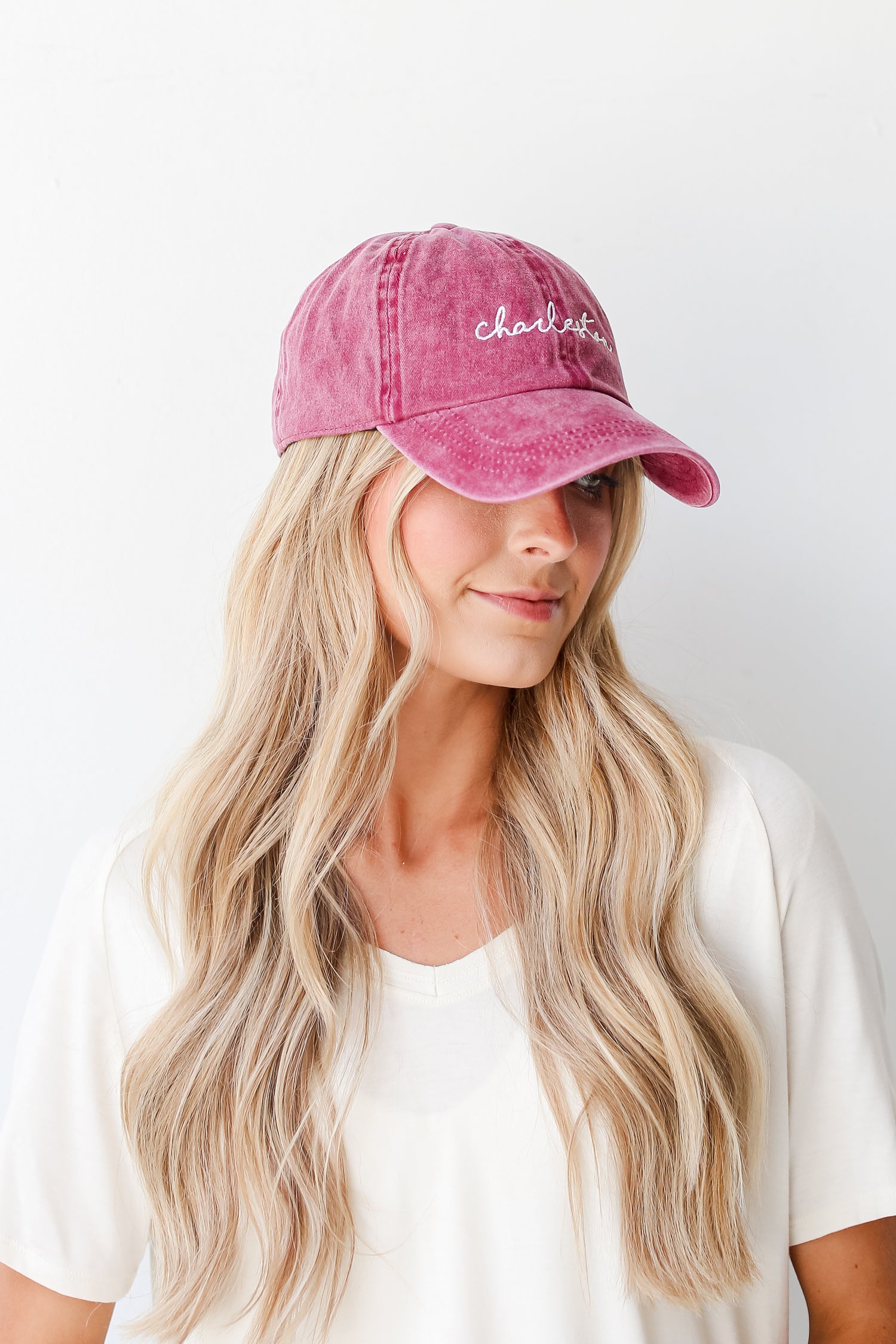 burgundy Charleston Script Embroidered Hat on model