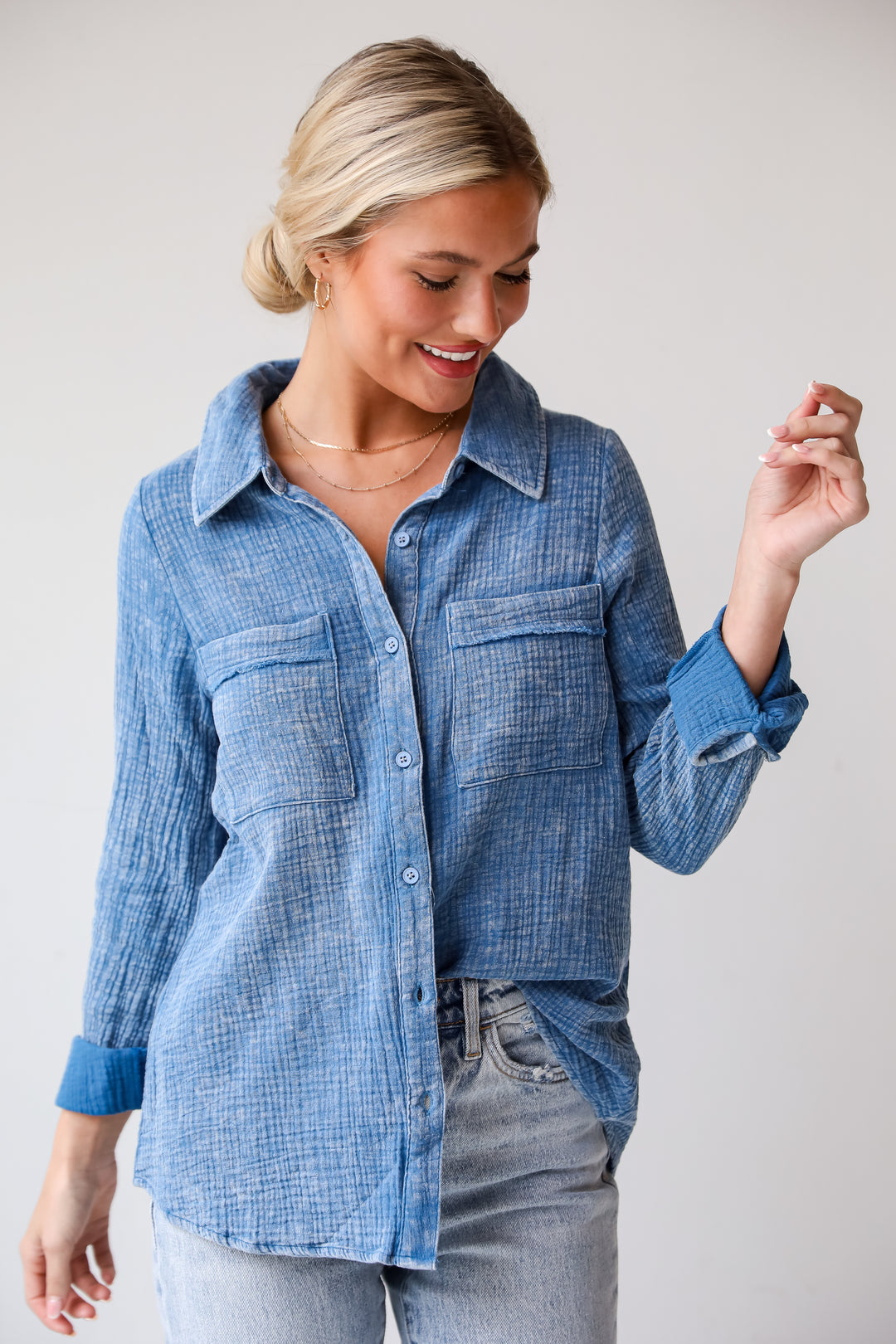 Morgan Denim Linen Button-Up Blouse features, Lightweight Crinkle Linen Fabrication, Acid Washed, Collared Neckline, Functional Button Front long Sleeves with Functional Button Cuffs