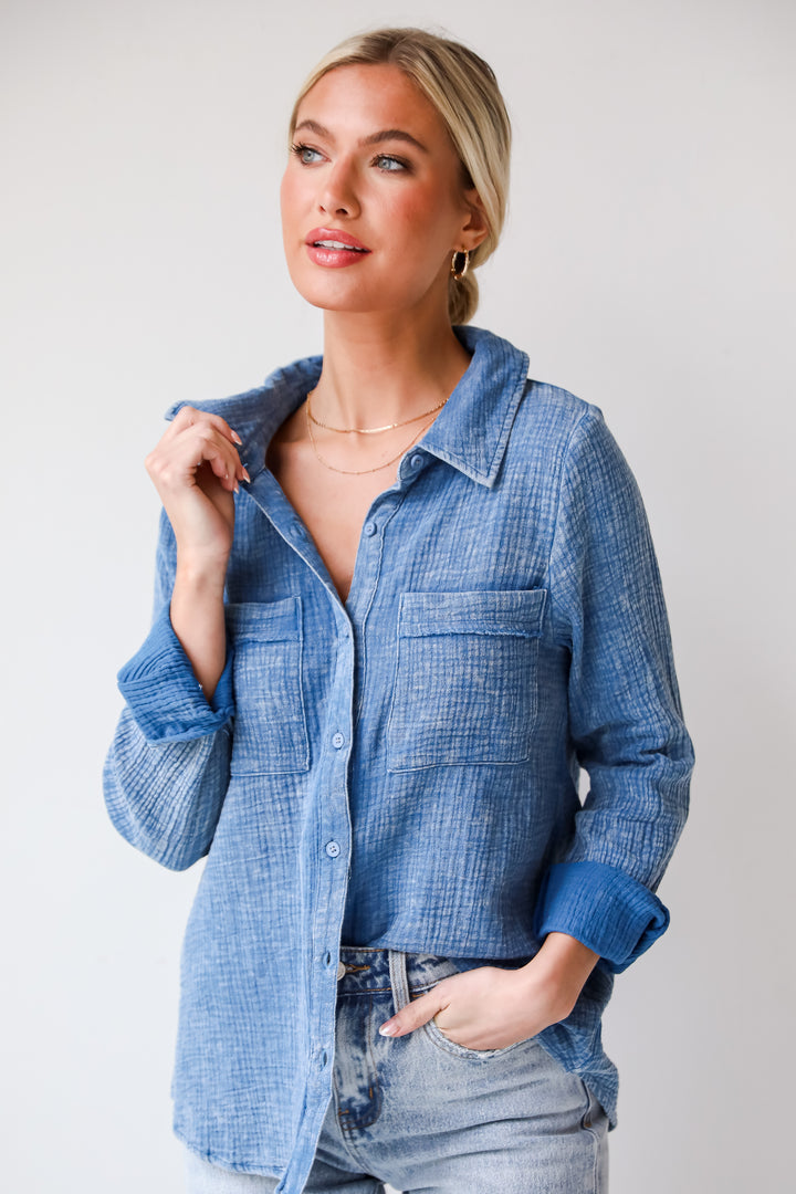 Morgan Denim Linen Button-Up Blouse features, Lightweight Crinkle Linen Fabrication, Acid Washed, Collared Neckline, Functional Button Front long Sleeves with Functional Button Cuffs