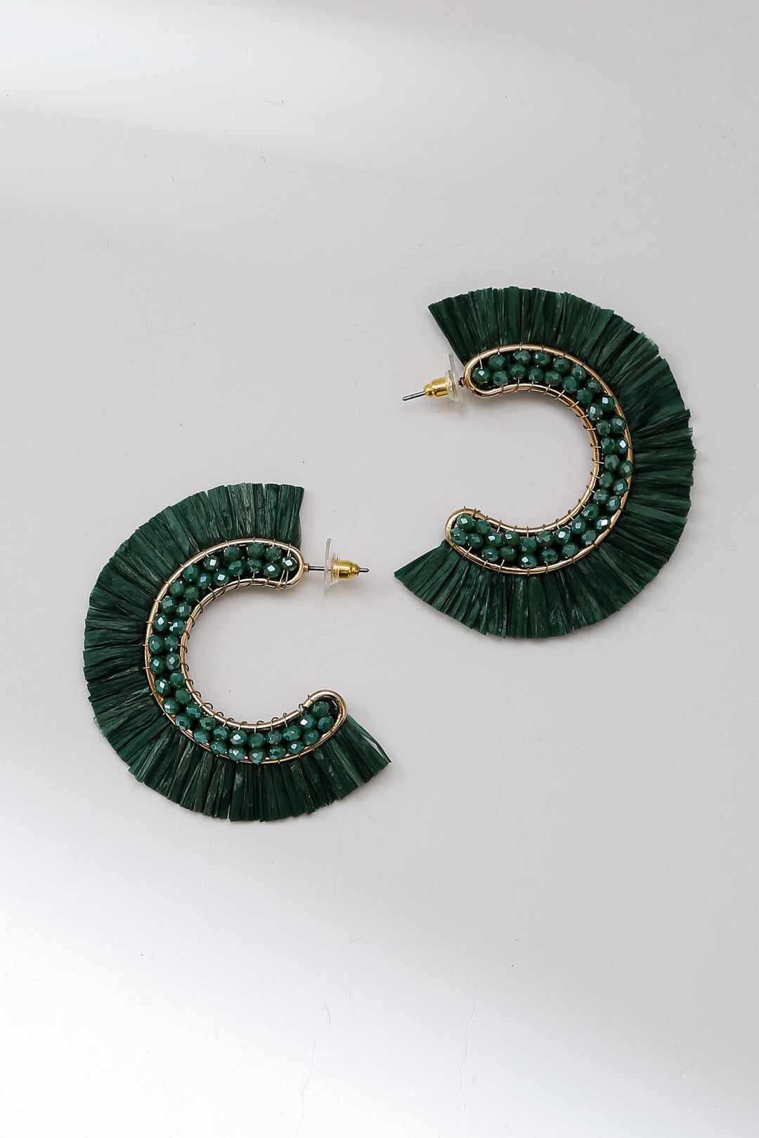 green Fringe Hoop Earrings flat lay