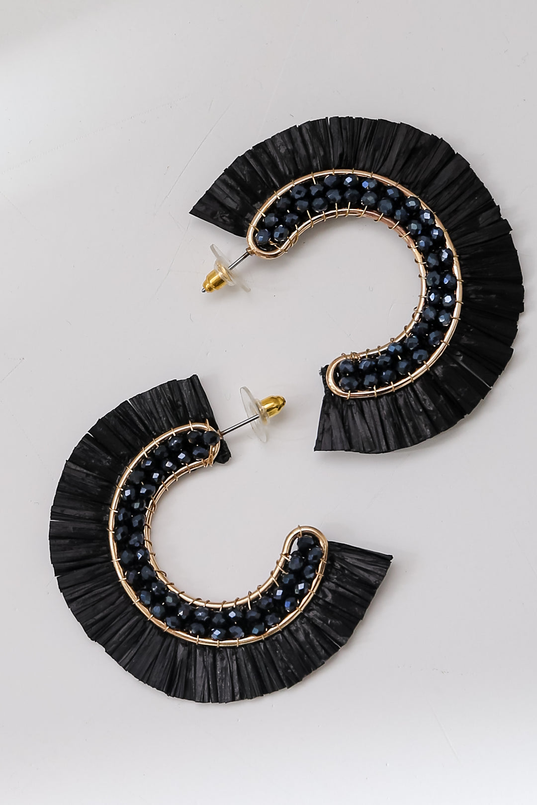 black Fringe Hoop Earrings flat lay