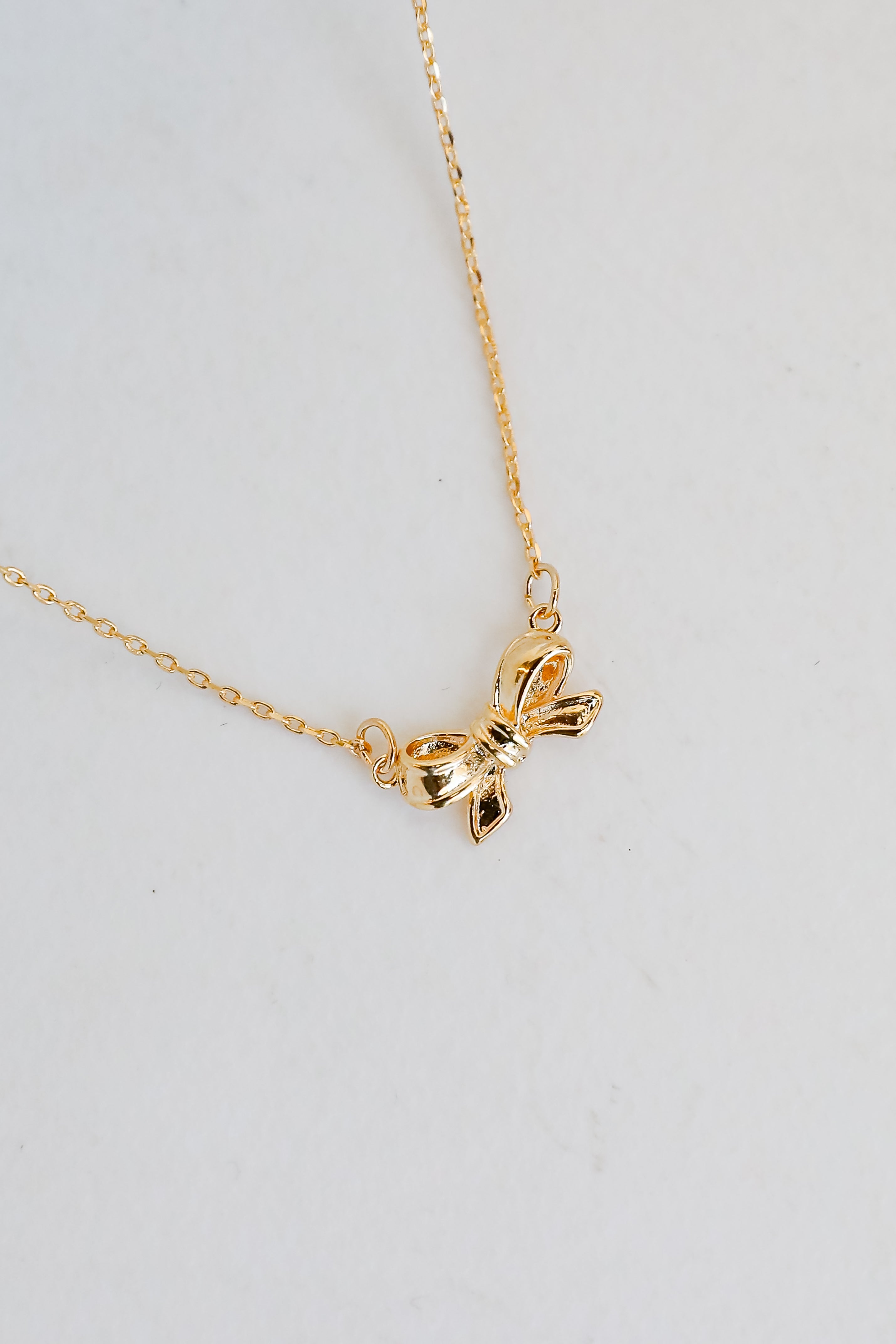 Brooke Gold Bow Charm Necklace