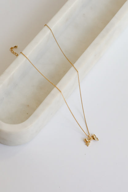 Gemma Gold Bow Charm Necklace