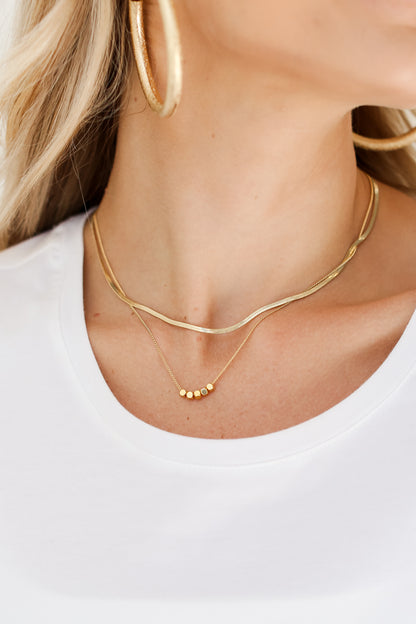 Gold Layered Chain Necklace on model