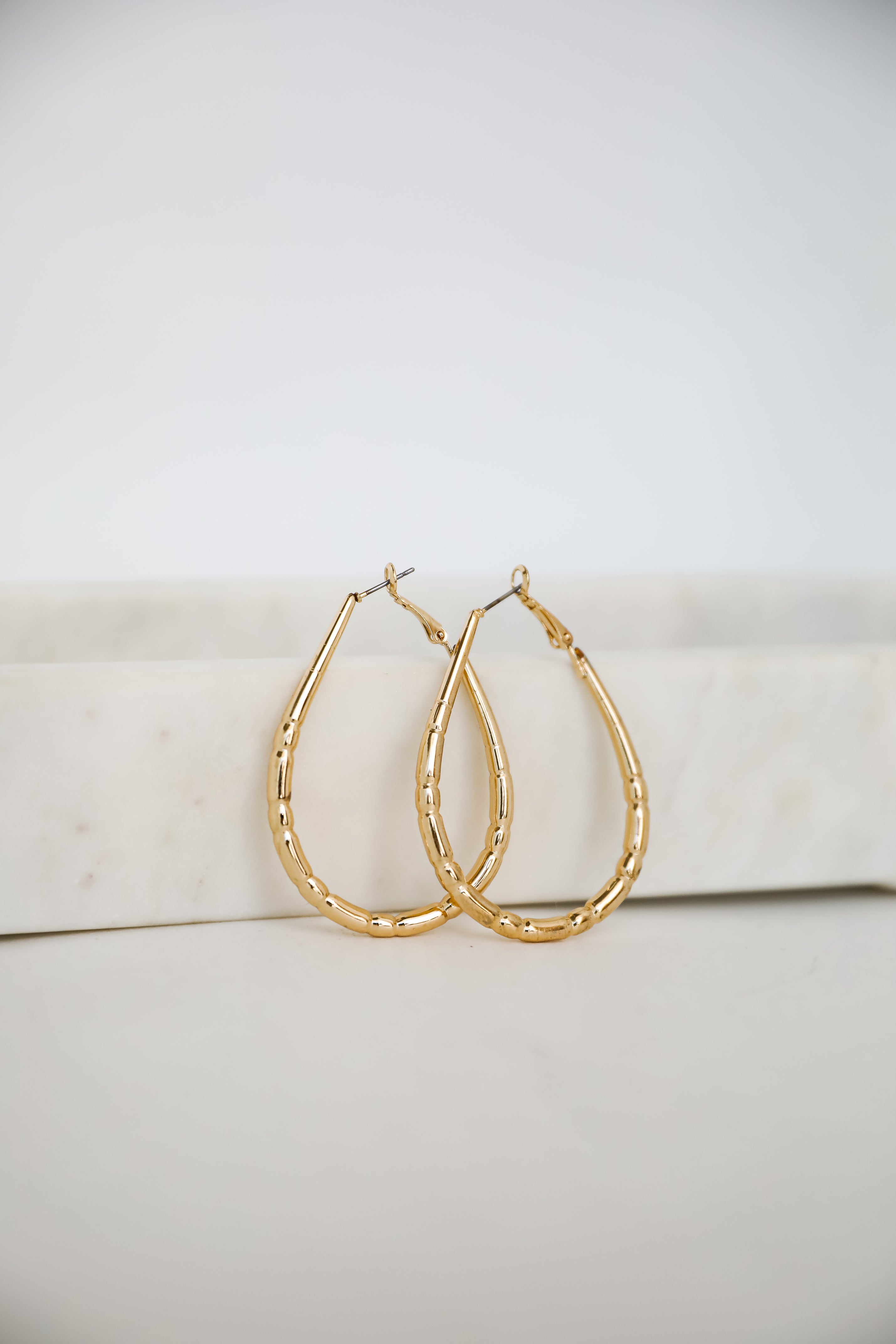 Brielle Gold Textured Teardrop Hoop Earrings