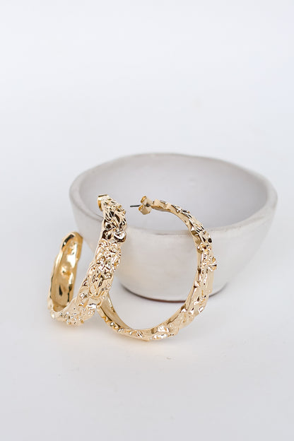 Gold Hammered Hoop Earrings flat lay