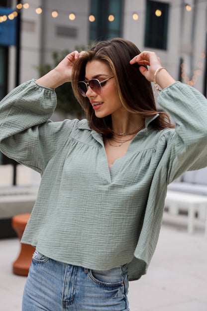 Alanna Linen Blouse is a Lightweight Crinkle Linen top, with a Collared V-Neckline, Long Balloon Sleeves with Elastic Cuffs. Relaxed Fit, 100% Cotton, and the perfect shade of blue and white. boutique tops. Women tops for summer. 