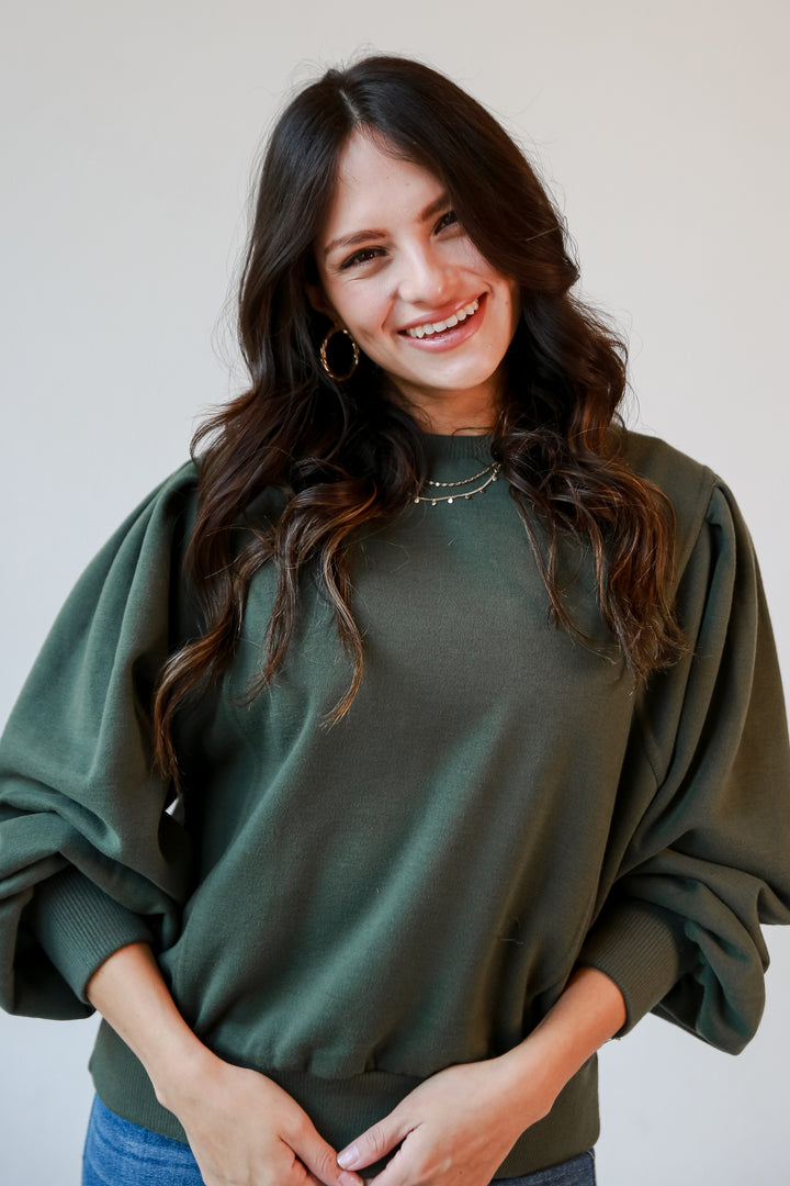 olive green sweatshirt