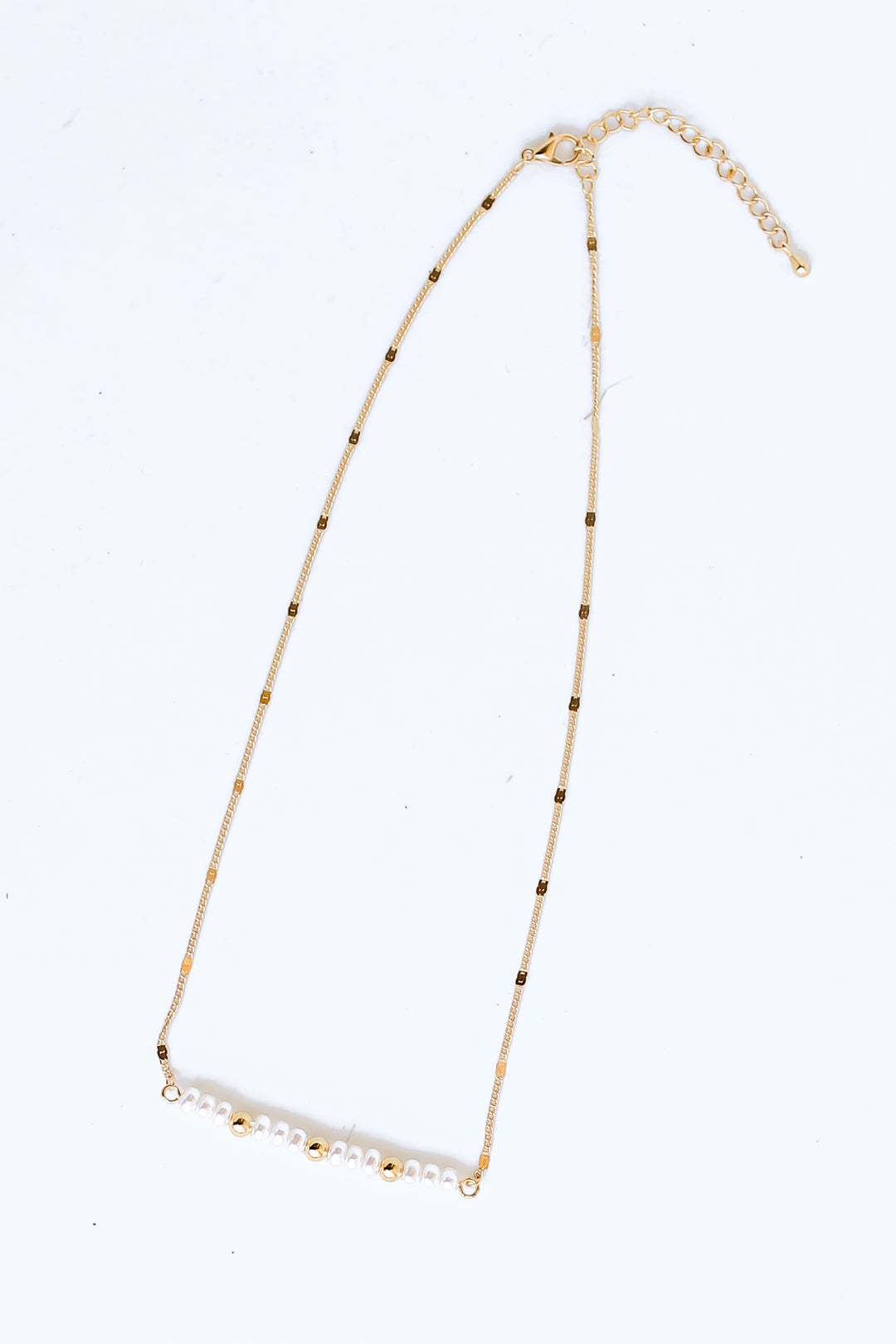 Gold Pearl Bar Necklace flat lay