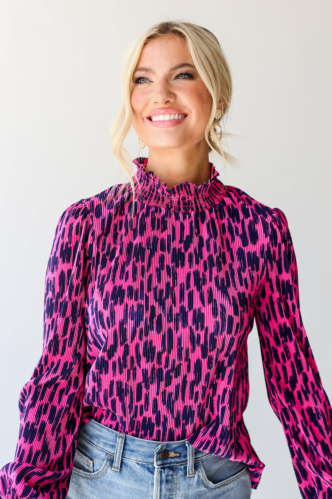 model wearing a pink Plisse Mock Neck Top