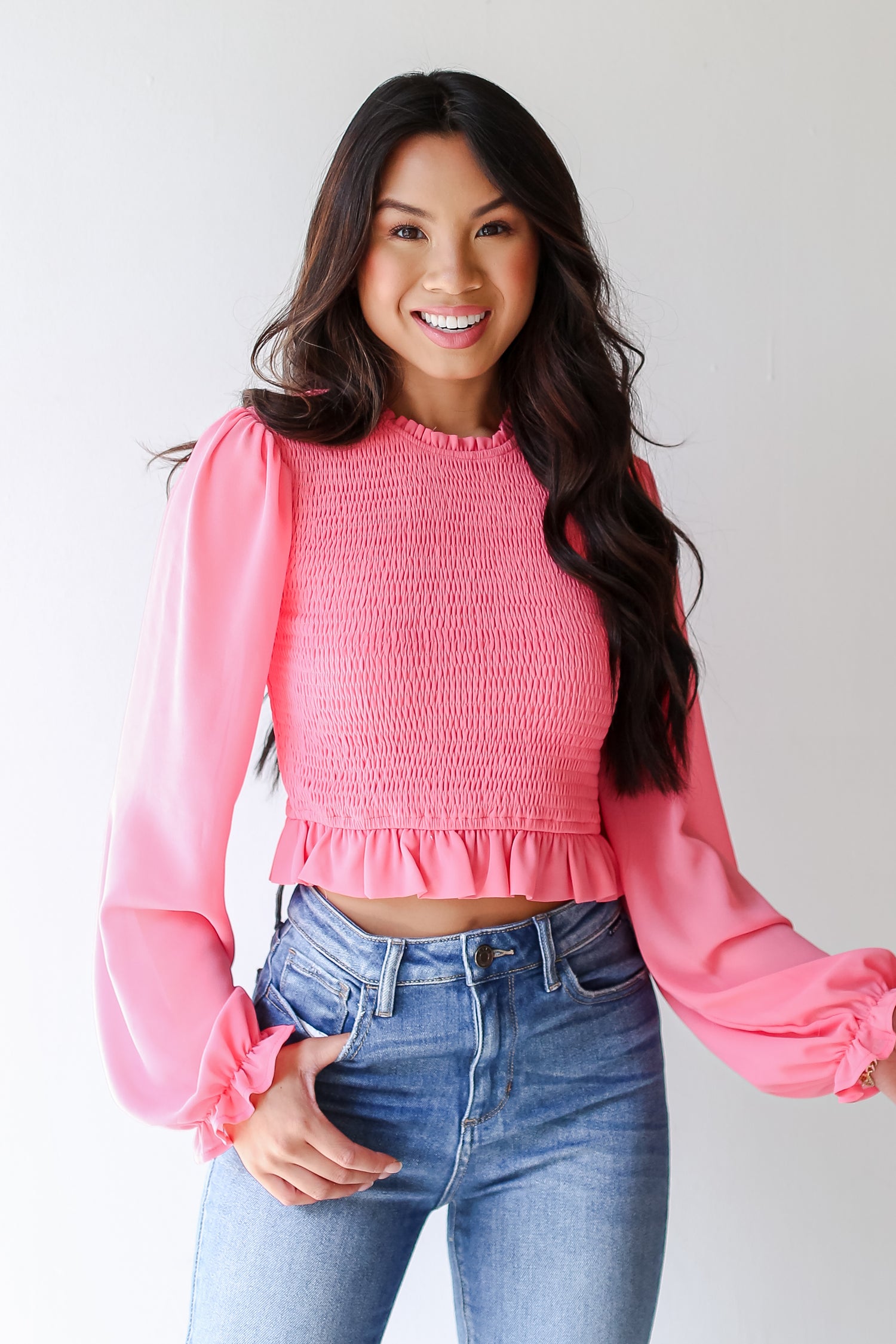 model wearing a pink Smocked Blouse