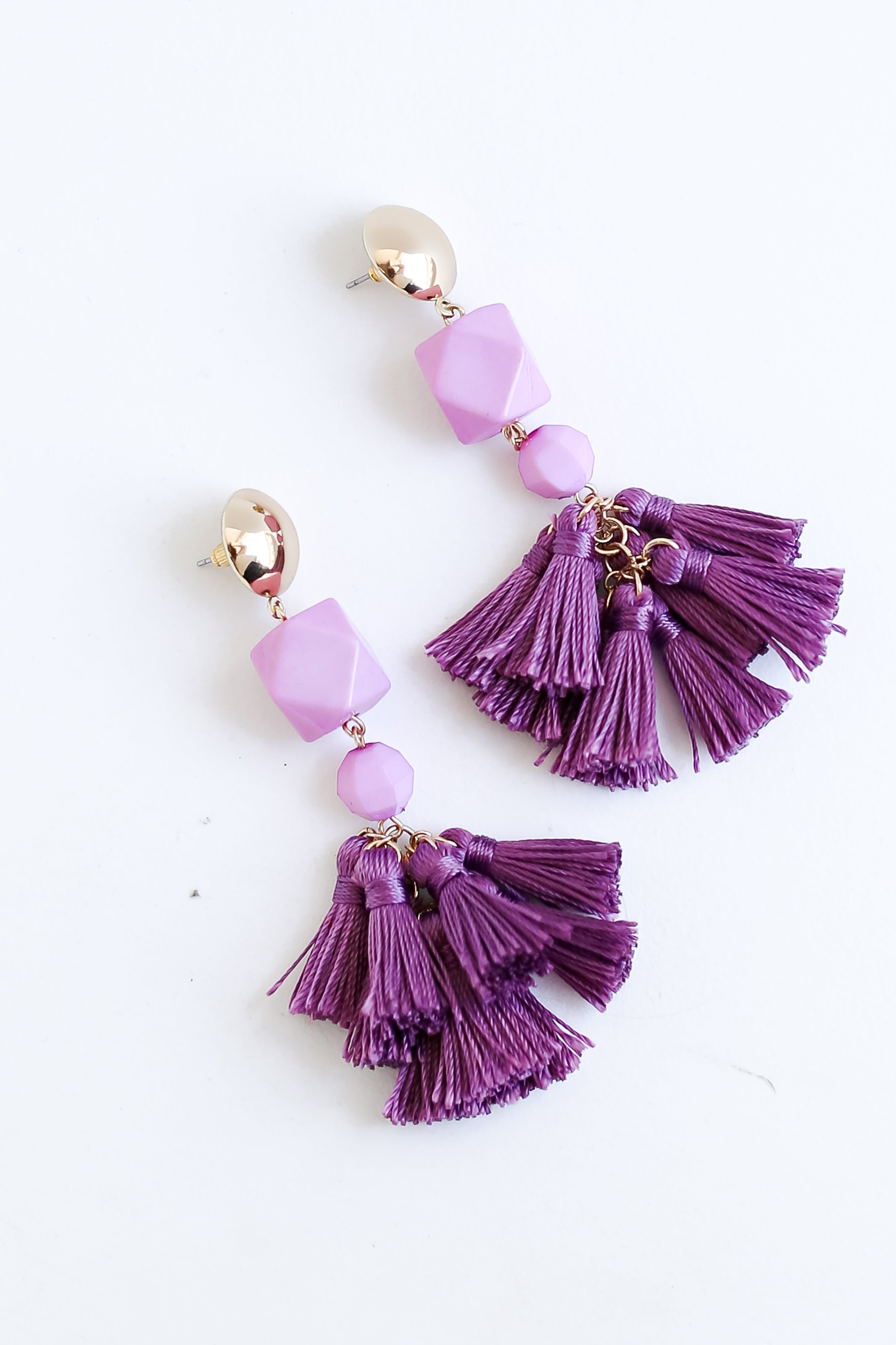 purple Tassel Statement Earrings flat lay