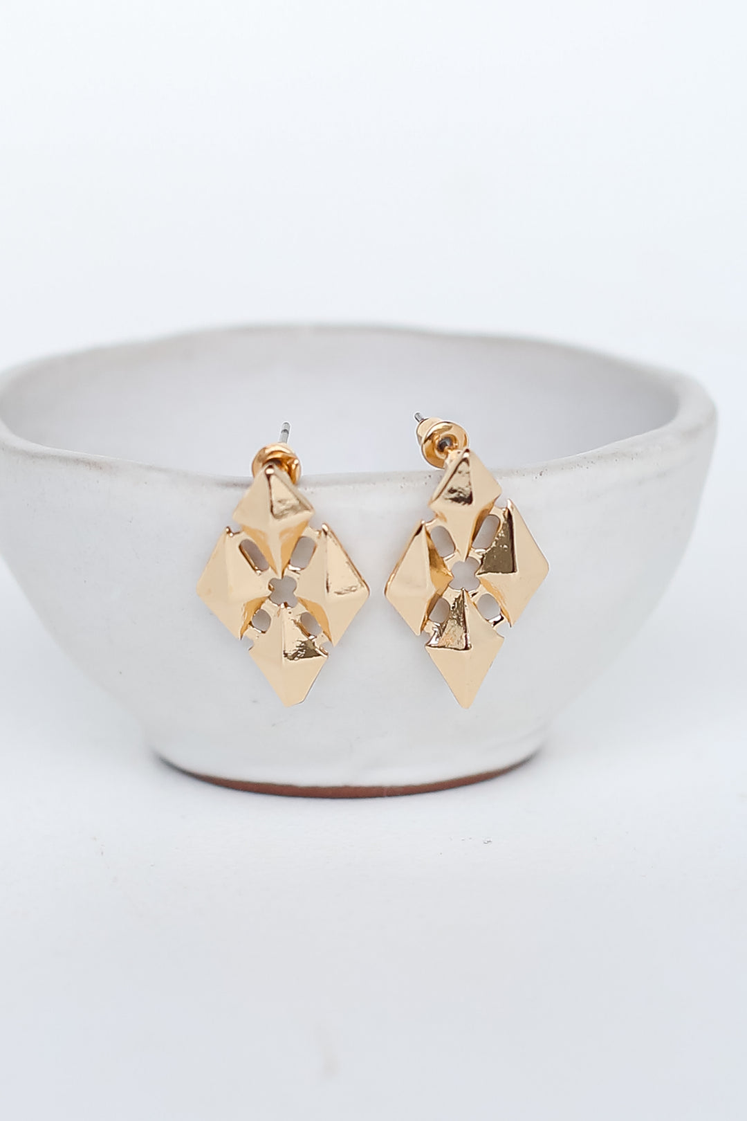 Gold Statement Stud Earrings flat lay