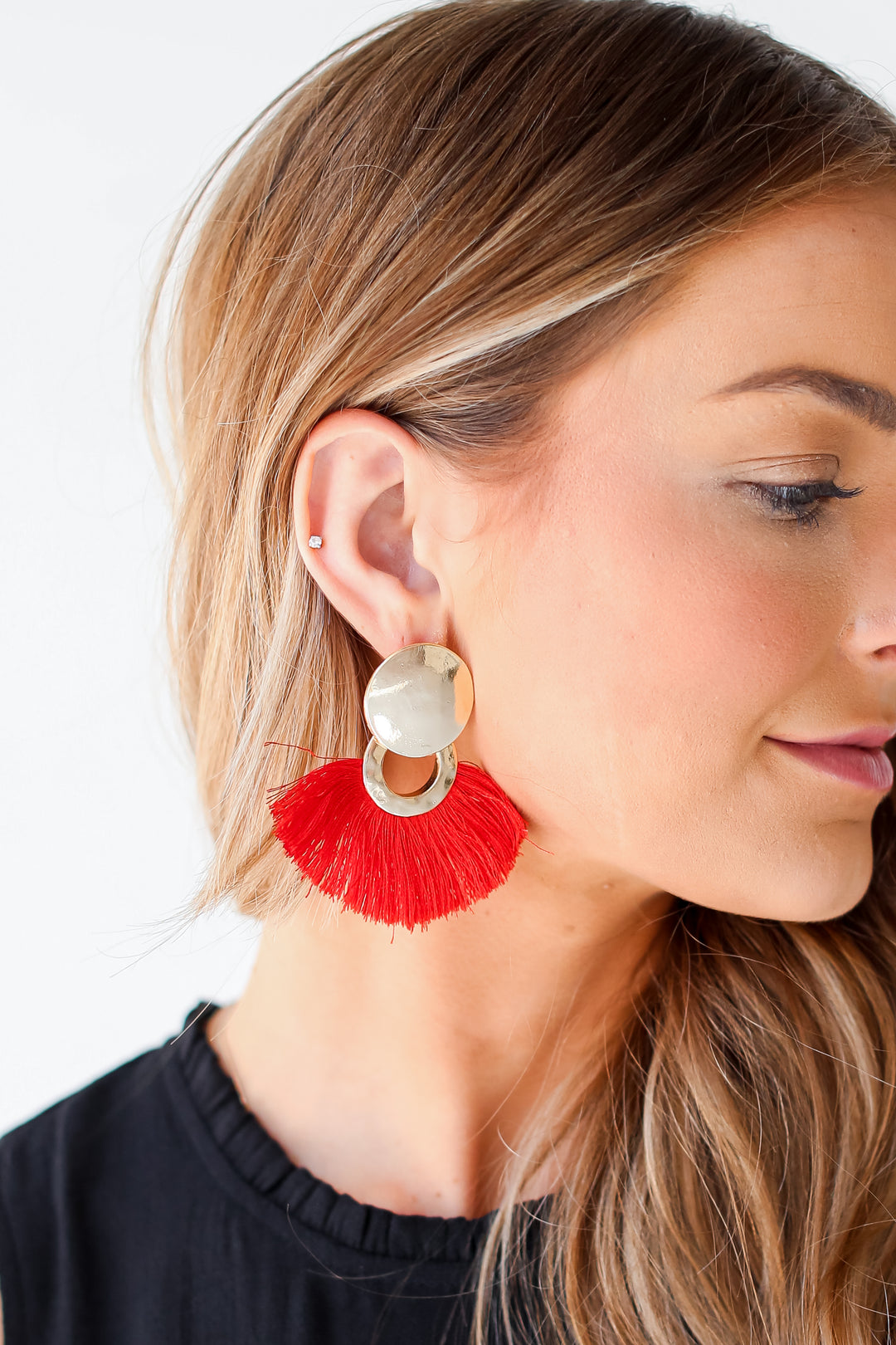 red Tassel Fan Earrings on model