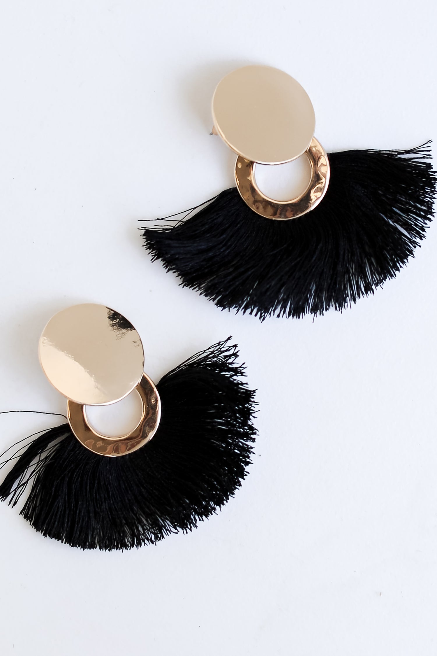 black Tassel Fan Earrings flat lay