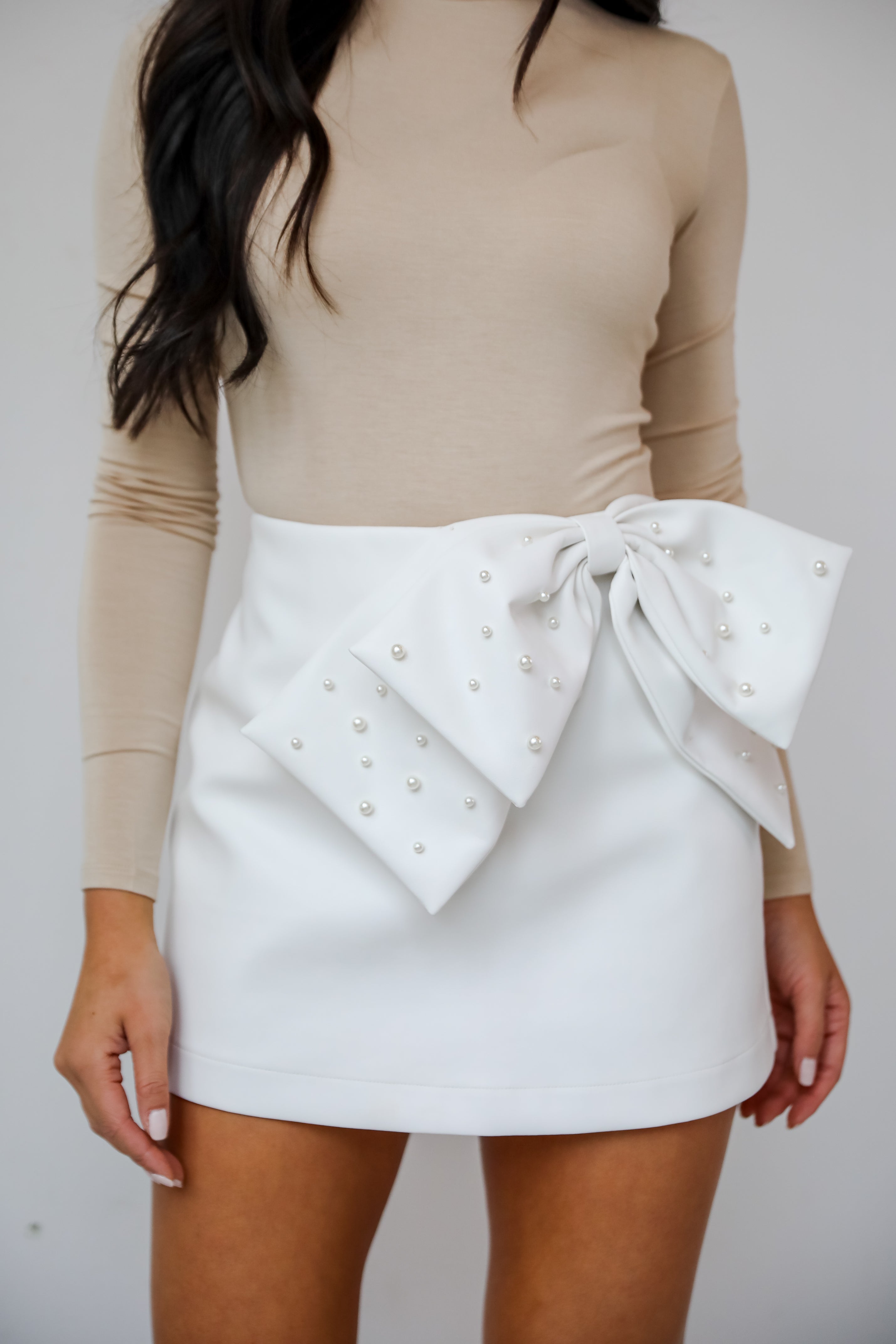 Notorious Perfection Off White Pearl Bow Leather Mini Skort