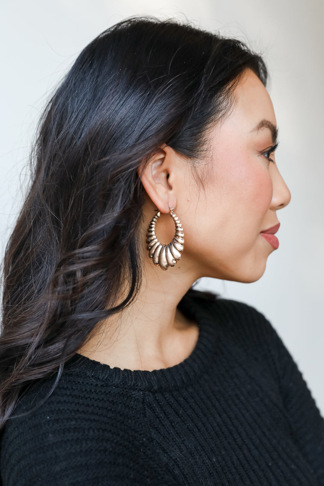 Gold Statement Hoop Earrings on model