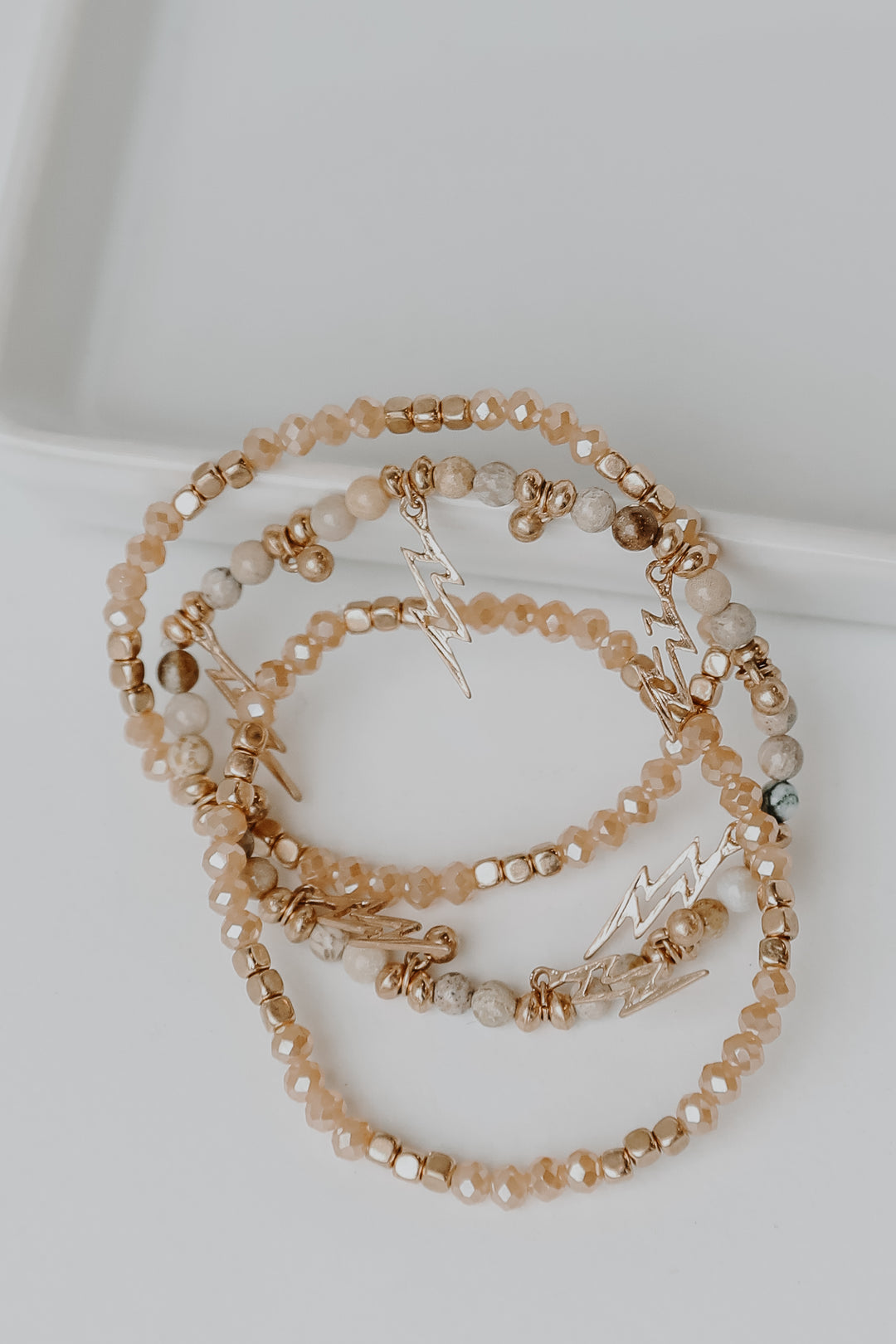 Beaded Lightning Bolt Bracelet Set in blush flat lay