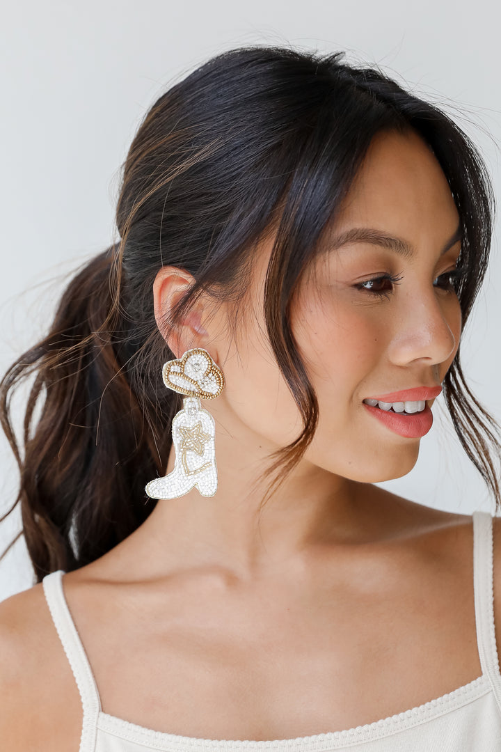 model wearing Star Cowgirl Boots Beaded Drop Earrings