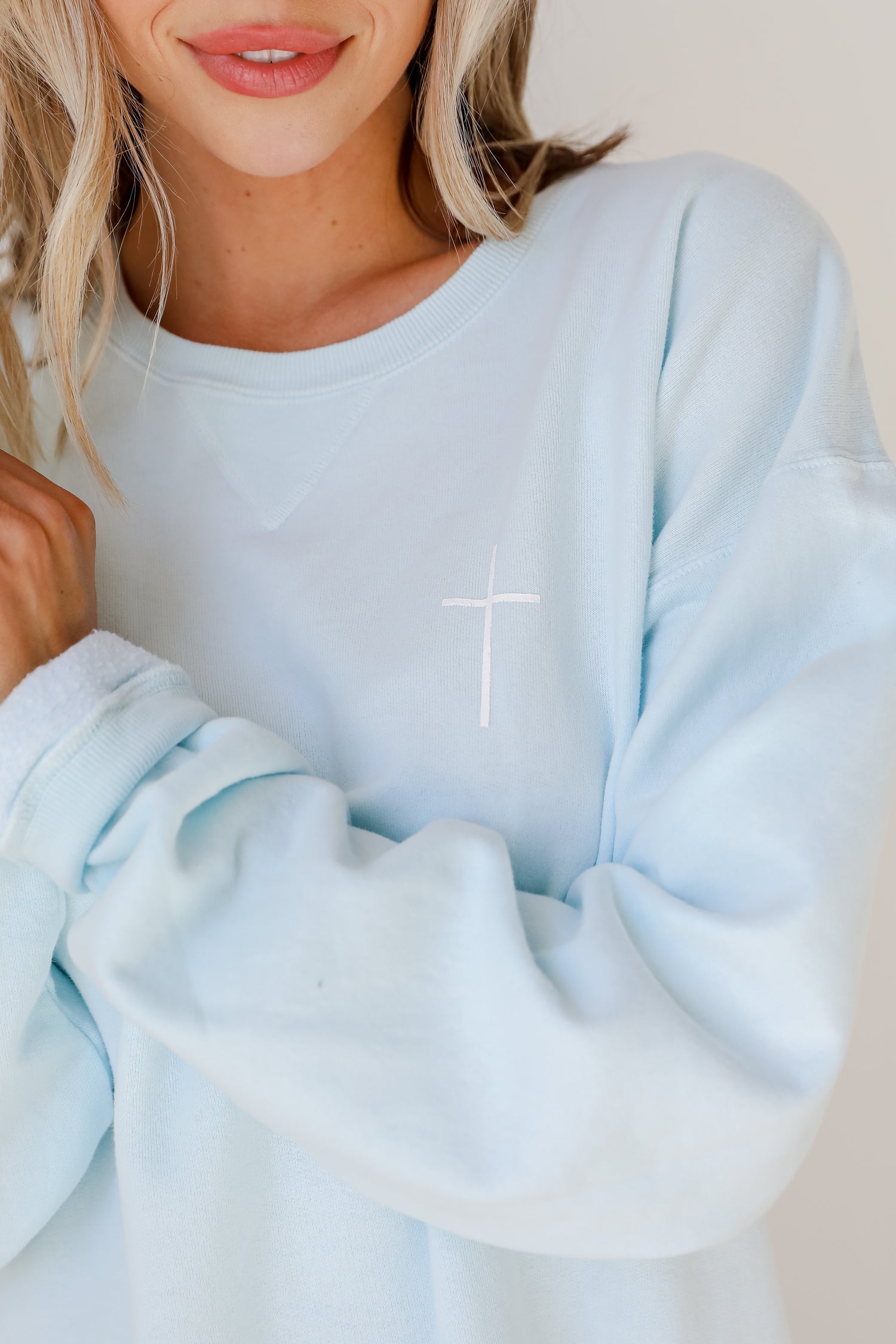 Light Blue God Is Good Cross Pullover close up