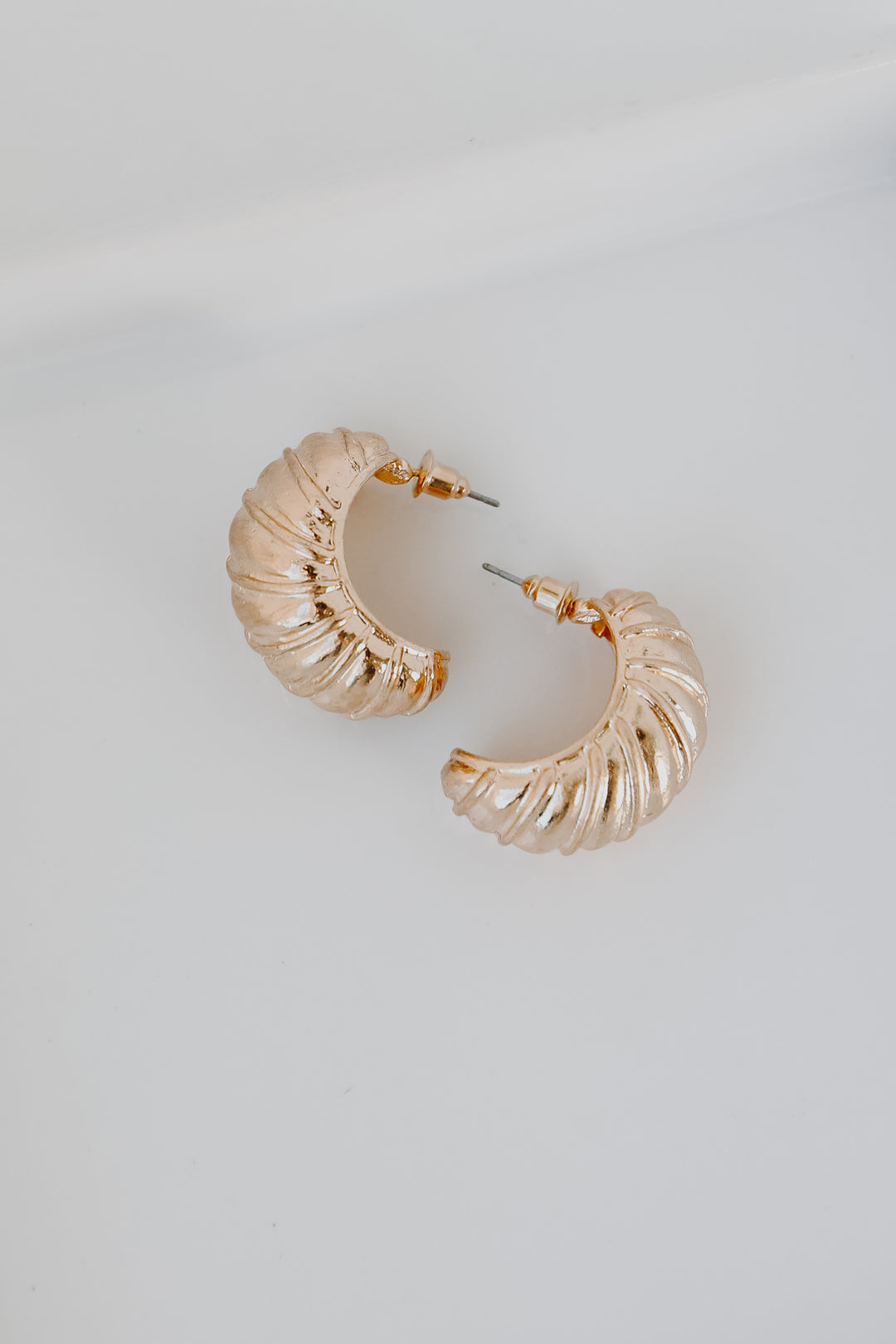 Gold Textured Hoop Earrings flat lay