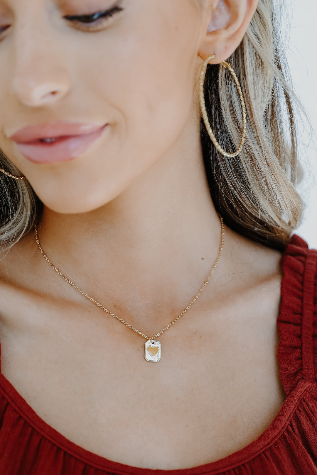 Gold Heart Pendant Necklace on model