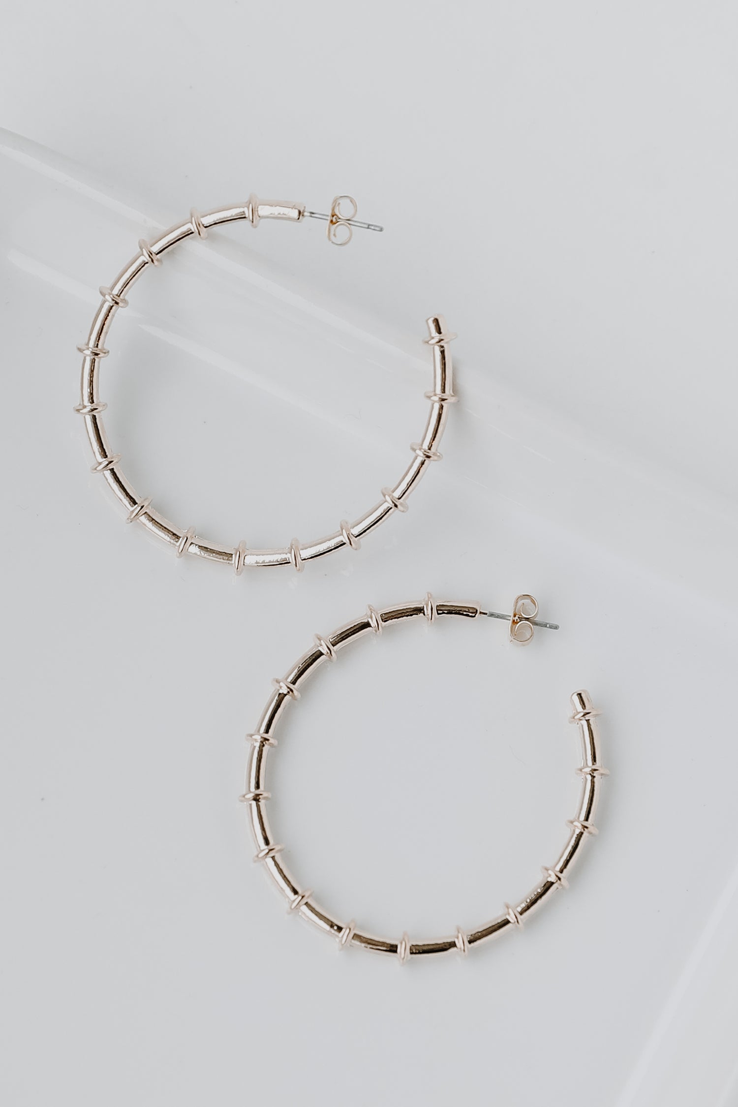 Gold Hoop Earrings flat lay