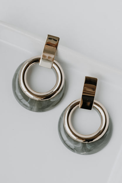 Acrylic Statement Earrings in grey flat lay