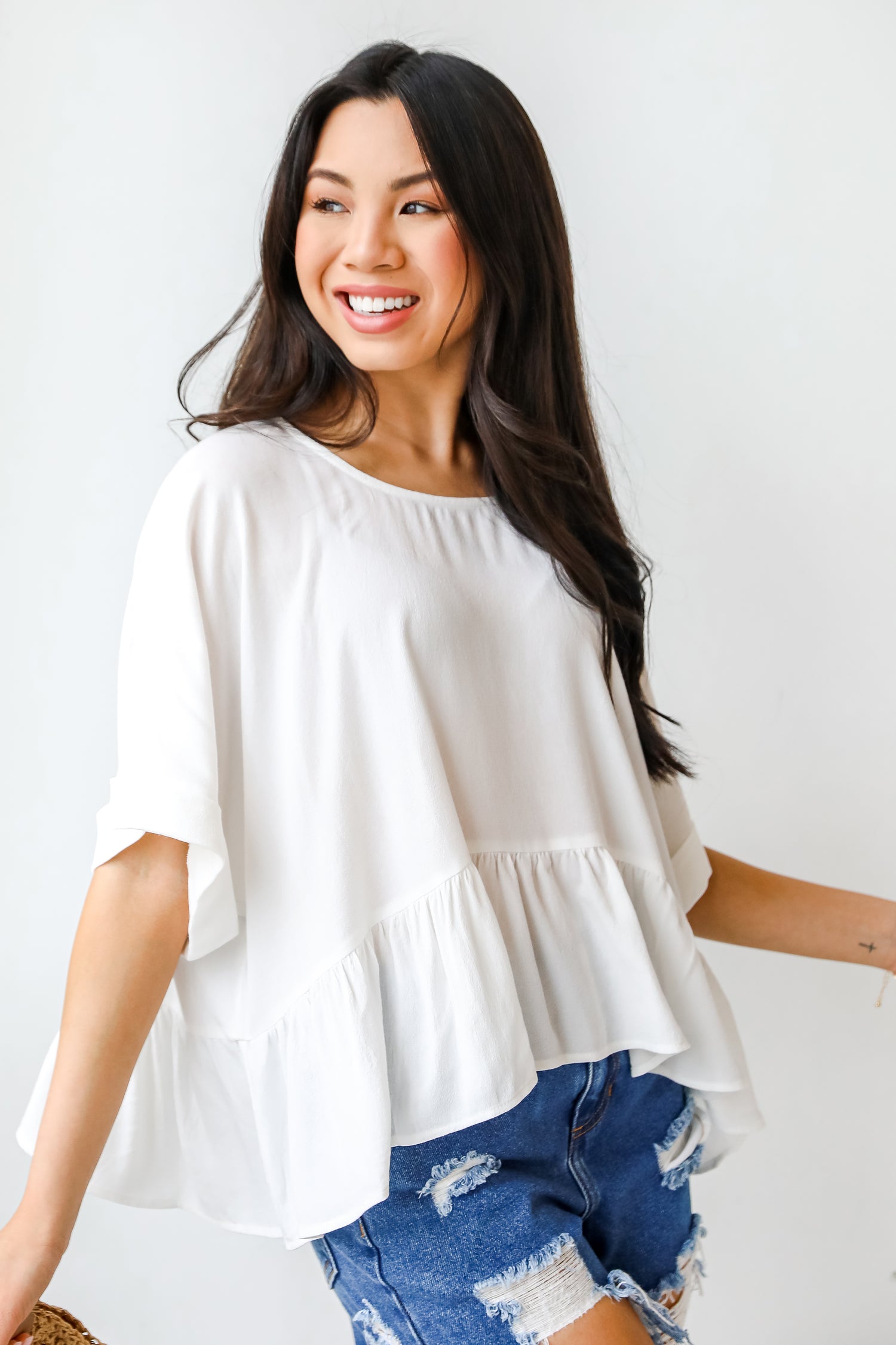 Peplum Blouse in white on model