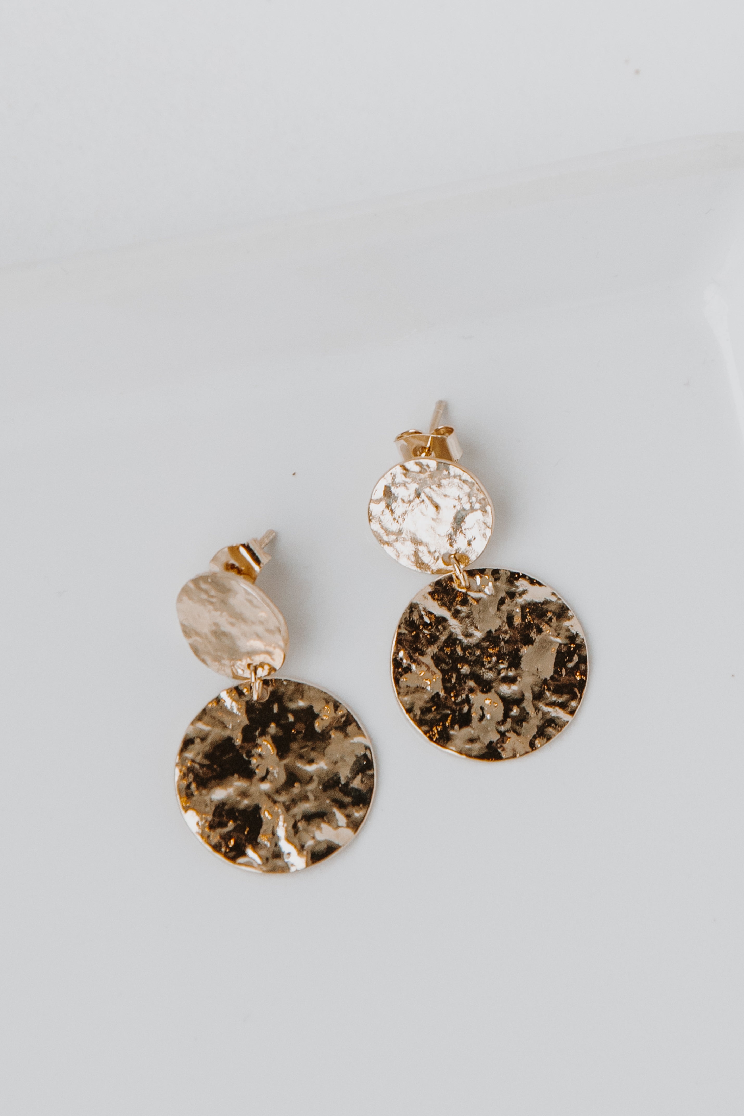 Gold Hammered Drop Earrings flat lay